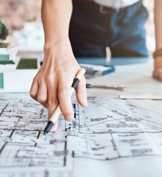 architect-reviewing-plans-at-a-bright-desk-2026-01-09-10-55-56-utc